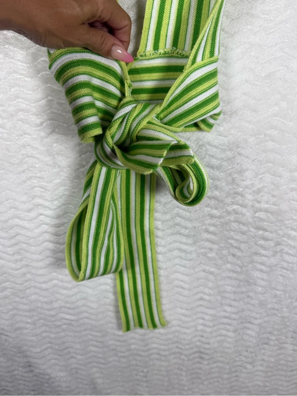 Cider striped halter top features a distinctive tie-back design vibrant green